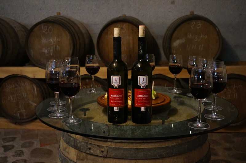 wine bottles and glasses on a table