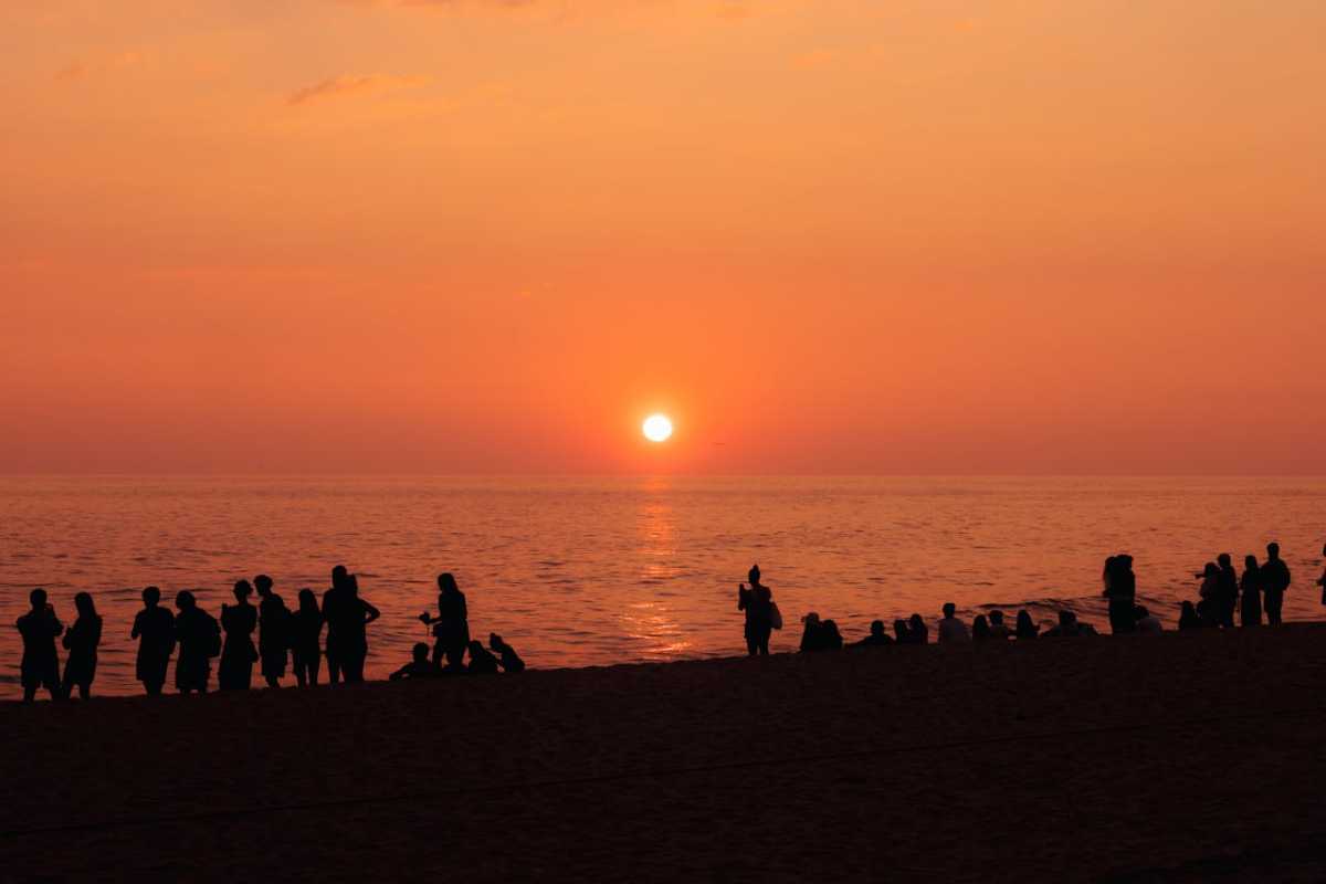 people enjoying sunset at the beach