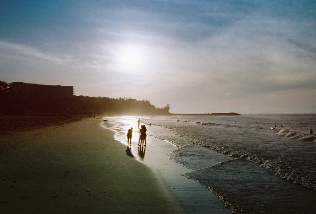 People during sunset on a beach