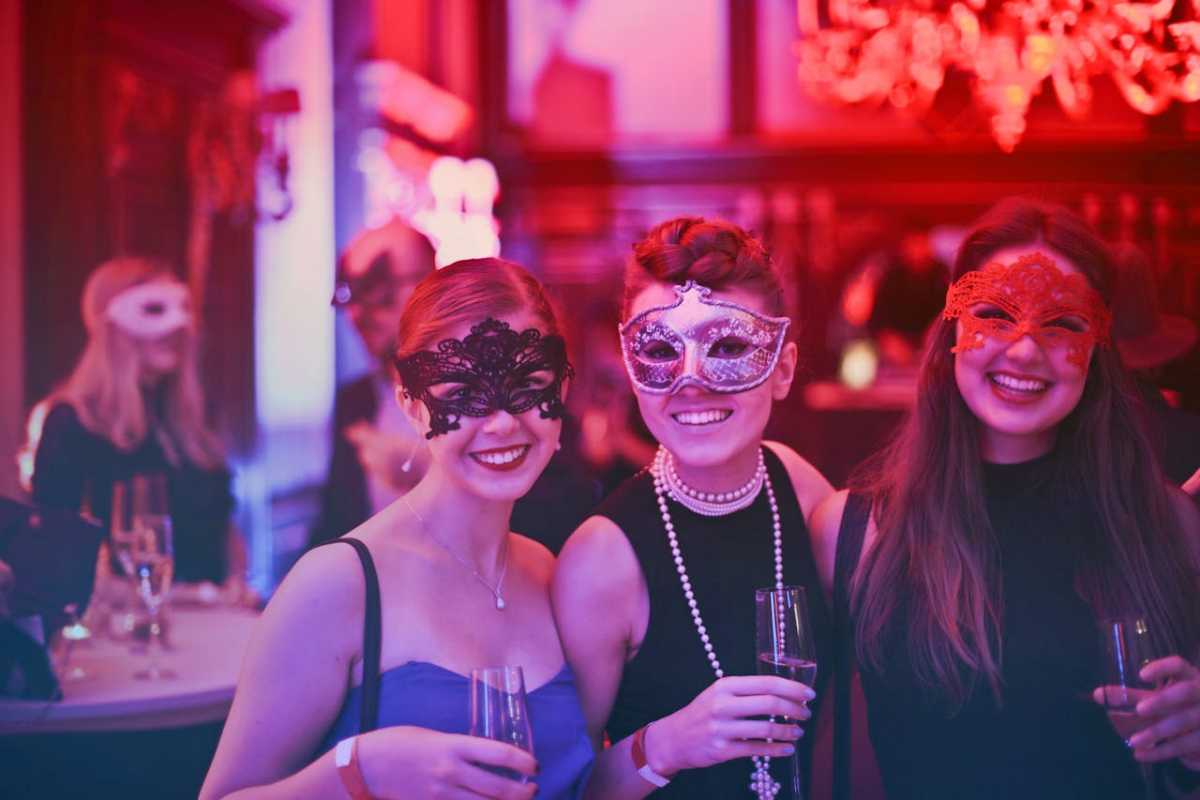 people having a blast at a masquerade party